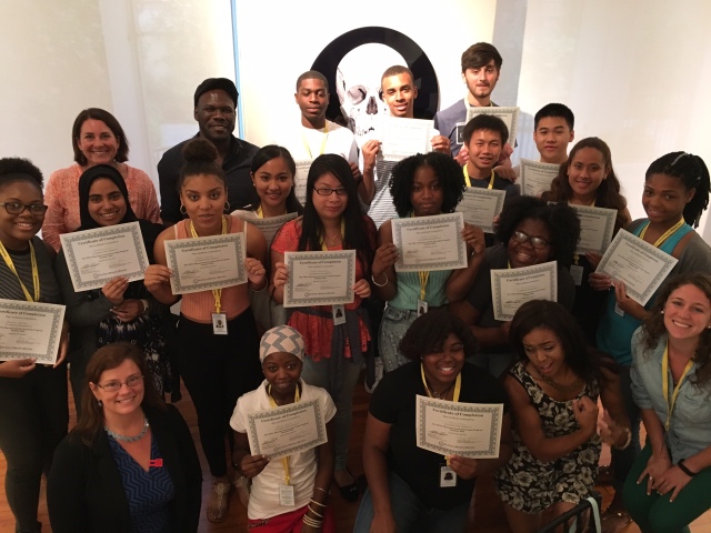 The 2016 cohort of the Teva Pharmaceuticals Internship program pose with Teva employees and hold certificates of completion for completing their summer internship